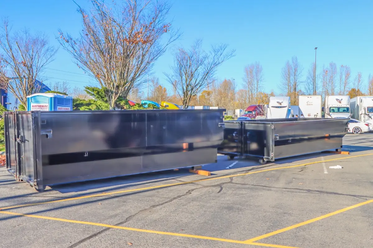 Professional dumpster rental service with roll-off container on residential driveway in Suisun City